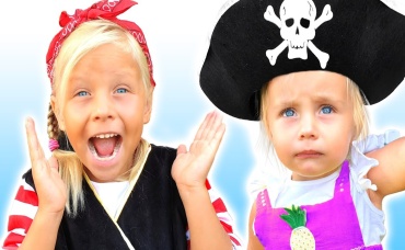 Alice and Dad Play on Pirate Ship with Big Parrot