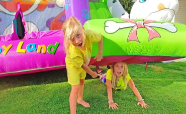 Kids Play and Get Stuck in the Playground with Trampolines and Swings
